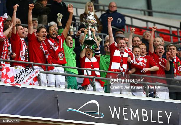 Captain Dean Keates of Wrexham lifts the trophy as his team mates celebrate after winning the FA Trophy Final between Wrexham and Grimsby Town at...