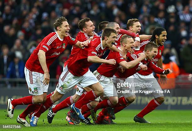 Wrexham players celebrate victory after a penalty shoot out during the FA Trophy Final between Wrexham and Grimsby Town at Wembley Stadium on March...
