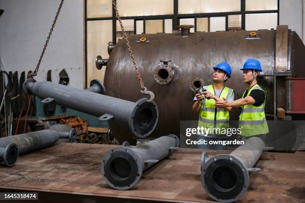 Moving Steel Workers Moving Large Steel Structure In A Machinery Factory High-Res ...