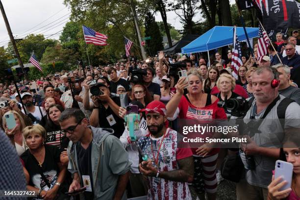 Staten Island residents gather to protest outside of a closed Catholic school-turned-migrant shelter on Staten Island on August 28, 2023 in New York...