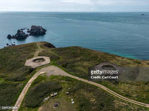 The remains of Battery Annes, formerly an open naval gun battery position with four concrete coast artillery emplacements, personnel shelters and...