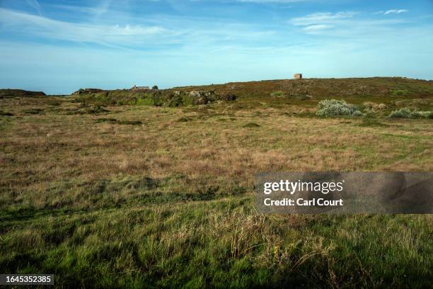 Walking trail crosses Longis Common, believed to be the site of mass graves for prisoners executed or worked to death by the Nazis while being used...