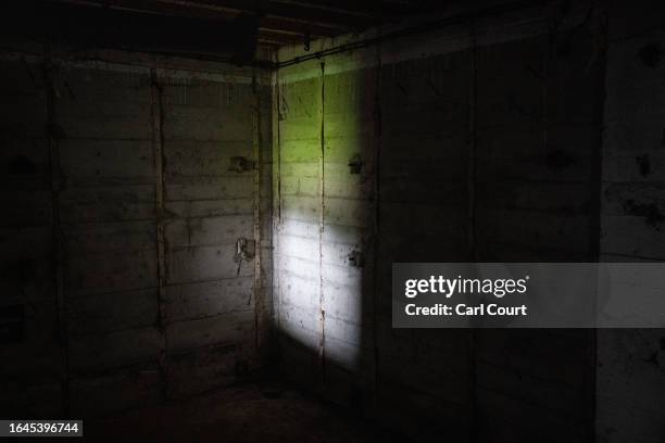 Light shines on the wall of a Nazi bunker on September 3, 2023 in Alderney, Guernsey. This year, the British government is expected to formally...
