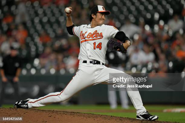 Shintaro Fujinami of the Baltimore Orioles pitches against the Chicago White Sox during the ninth inning at Oriole Park at Camden Yards on August 28,...