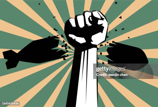 fist breaks bomb, anti war, peace poster - nuclear weapon stock illustrations