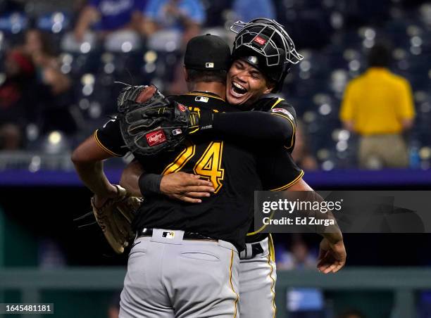 Johan Oviedo of the Pittsburgh Pirates celebrates his complete-game shutout against the Kansas City Royals with Endy Rodriguez of the Pittsburgh...