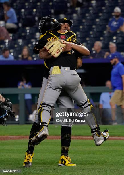 Johan Oviedo of the Pittsburgh Pirates celebrates his complete-game shutout against the Kansas City Royals with Endy Rodriguez of the Pittsburgh...