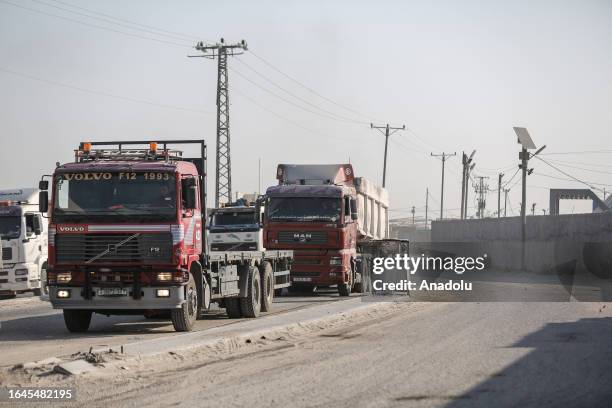 Trucks wait at the closed Kerem Shalom border crossing after Israel decided Monday to indefinitely halt the entry of goods from Gaza through the...