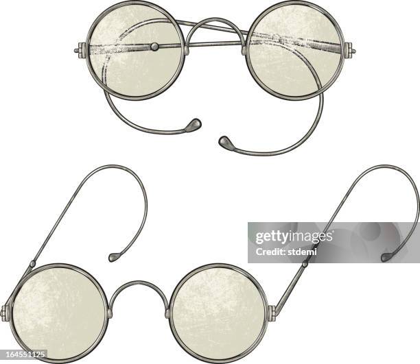 an image of two round lens vintage glasses - round eyeglasses clip art stock illustrations