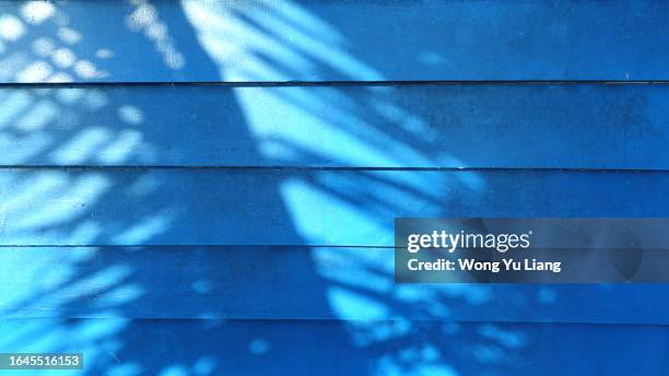 blue wooden plank background with shadows - striped wall stock pictures, royalty-free photos & images