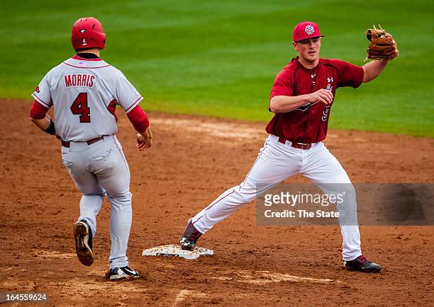 South Carolina shortstop Joey Pankake forces out Arkansas runner Jacob Morris in the fourth inning in Columbia, South Carolina, Sunday, March 24,...