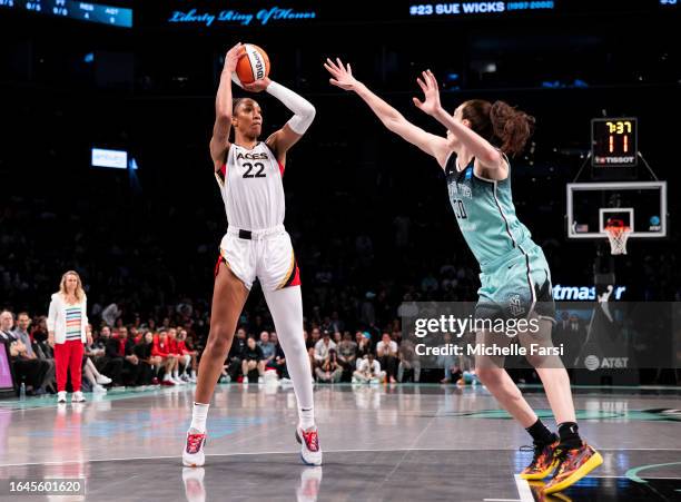 Ja Wilson of the Las Vegas Aces make a shot against Breanna Stewart of the New York Liberty at Barclays Center on August 28, 2023 in New York City.
