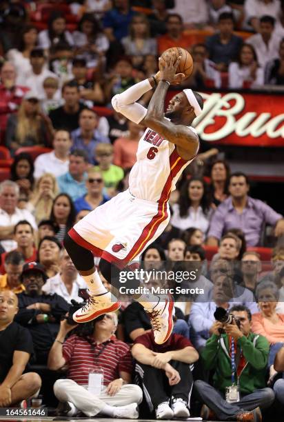 Forward LeBron James of the Miami Heat shoots against the Charlotte Bobcats at American Airlines Arena on March 24, 2013 in Miami, Florida. NOTE TO...