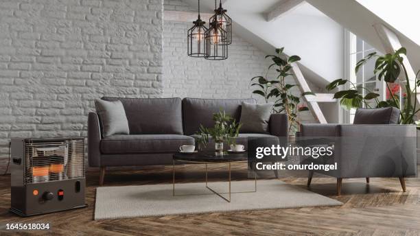 modern living room interior with electric infrared heater, sofa, armchair and houseplants in the attic - halogen electric heater stock pictures, royalty-free photos & images