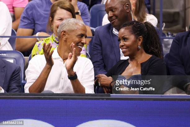 Former President of the United States Barack Obama and former First Lady Michelle Obama attend the men's singles first round match between Novak...