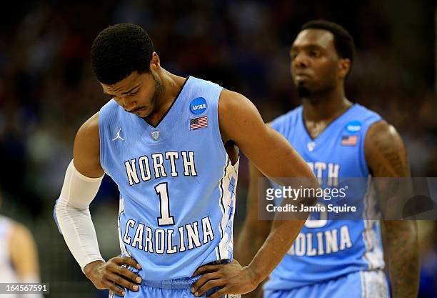 Dexter Strickland of the North Carolina Tar Heels stands on the court with his head down against the Kansas Jayhawks during the third round of the...