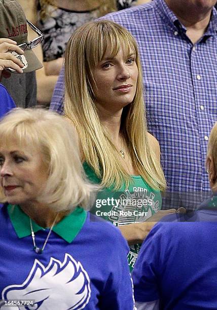 Amanda Marcum, the wife of head coach Andy Enfield of the Florida Gulf Coast Eagles, watches in the first half against the San Diego State Aztecs...