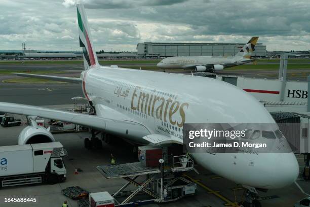 An Emirates A380 waits for passengers to board from the gate at Heathrow Airport on January 03, 2023 in London, England.