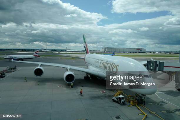 An Emirates A380 waits for passengers to board from the gate at Heathrow Airport on January 03, 2023 in London, England.