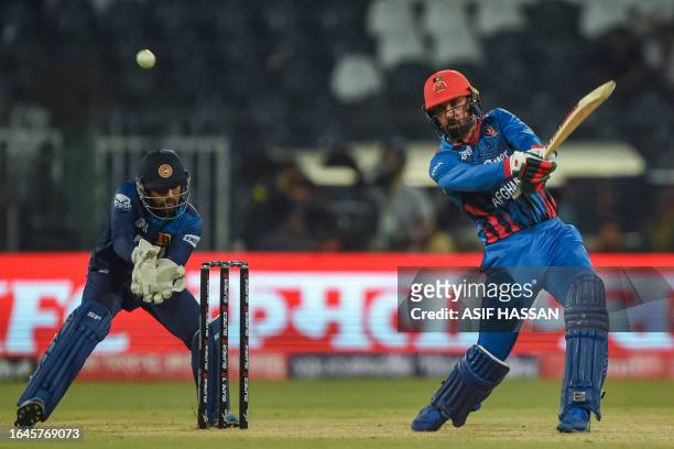Afghanistan's Mohammad Nabi plays a shot during the Asia Cup 2023 one-day international cricket match between Sri Lanka and Afghanistan at the...