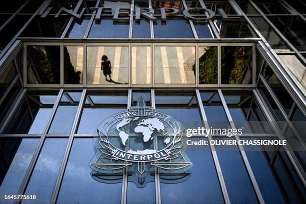 This photograph taken in Lyon, eastern France, on September 5, 2023 shows the entrance of the International Criminal Police Organization...