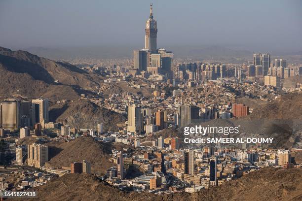 Photograph shows the Abraj Al-Bait Towers also known as the Mecca Royal Hotel Clock Tower, from Jabal al-Noor or 'Mountain of Light' overlooking the...
