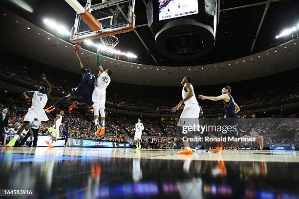 Brandon Paul of the Illinois Fighting Illini goes up against Julian Gamble of the Miami Hurricanes in the first half during the third round of the...