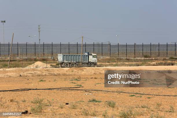 Palestinian trucks in front of the Kerem Shalom commercial crossing after the Israeli ban on Gaza exports dealt a blow to the long-suffering economy,...