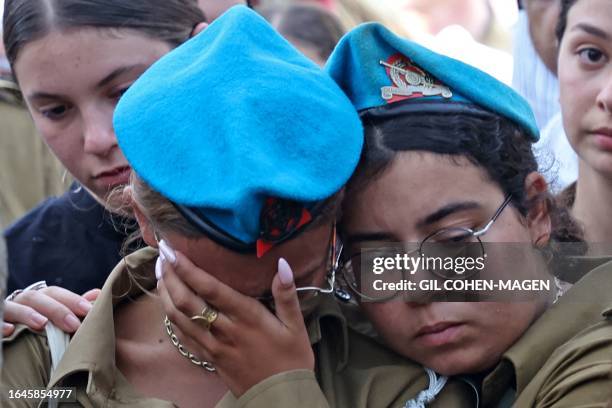 Israeli soldiers mourn during the funeral of fellow soldier Maksym Molchanov in Tel Aviv on September 5, 2023. A Palestinian rammed a truck into a...