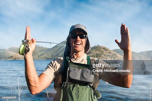 the fish that got away - man catching stock pictures, royalty-free photos & images