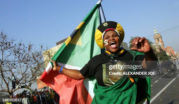 Supporter of former South African deputy President Jacob Zuma shows her support during his corruption trial outside the High Court premises 31 July...