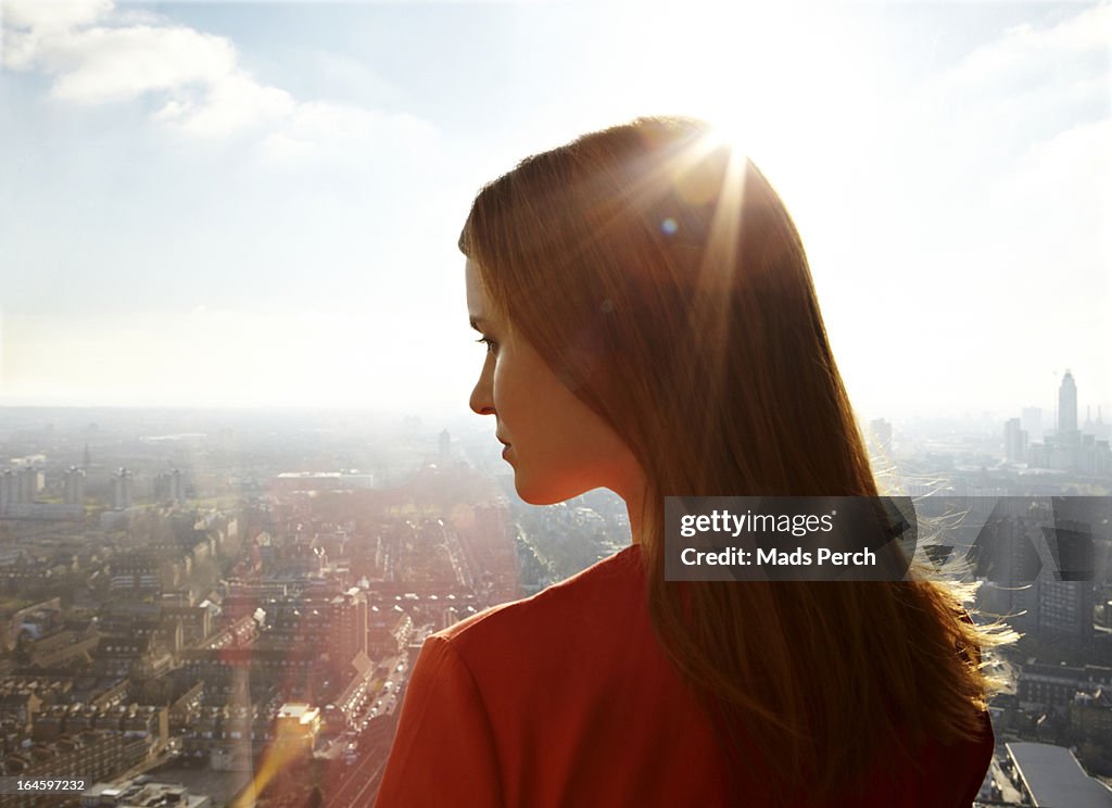 Girl looking down on the city