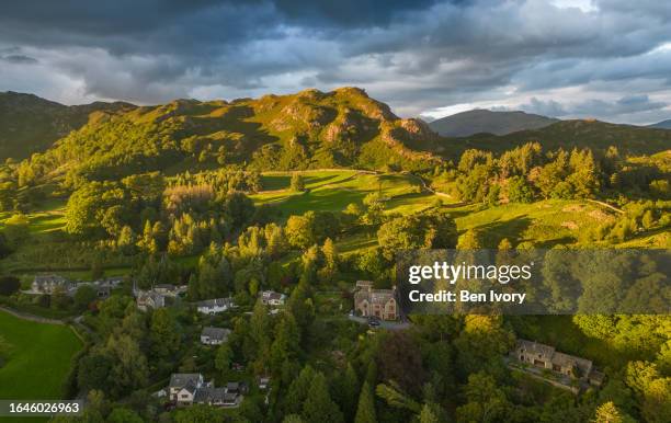 loughrigg fell in soft evening summer light - loughrigg fell stock pictures, royalty-free photos & images