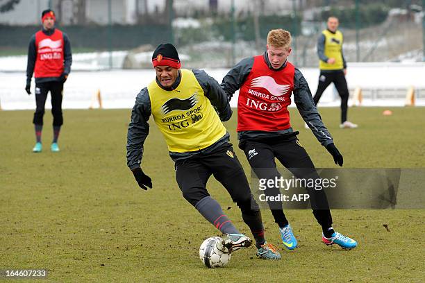 Belgium's Vincent Kompany and Belgium's Kevin De Bruyne practice during a training session on March 25, 2013 at the Neerpede training center in...