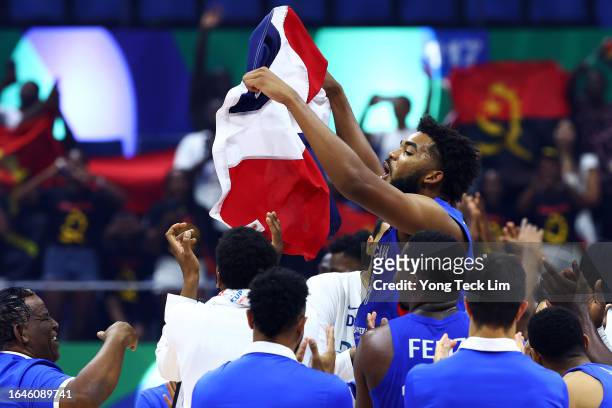 Karl-Anthony Towns of the Dominican Republic celebrates with teammates after the FIBA Basketball World Cup Group A victory over Angola at Araneta...