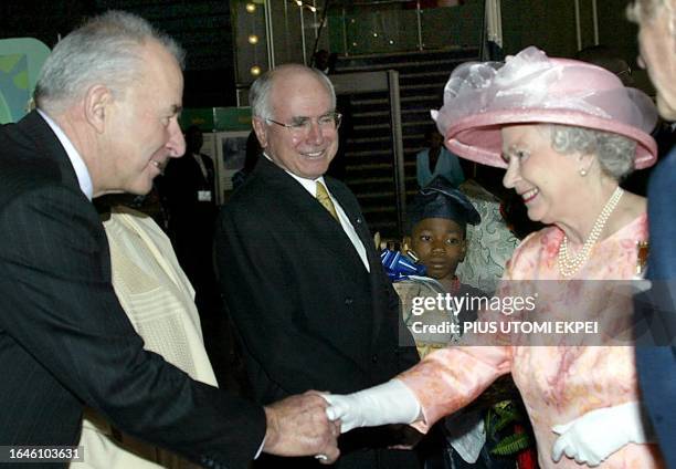 Commonwealth Secretary General Don McKinnon welcomes Queen Elizabeth II and Prince Philip the Duke of Edinburgh at the opening of the Commonwealth...