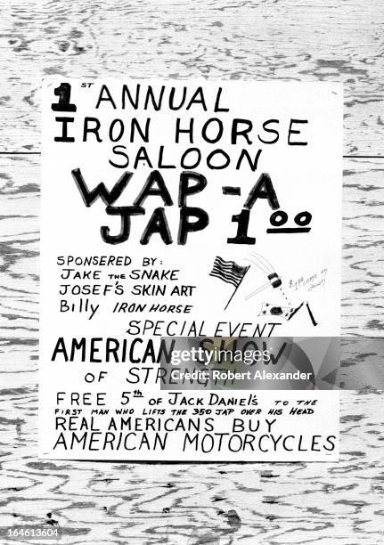 Sign advertises a bar's 'Wap-A-Jap' event during the annual Bike Week in Daytona Beach, Florida. For a dollar, riders of American-made motorcycles...