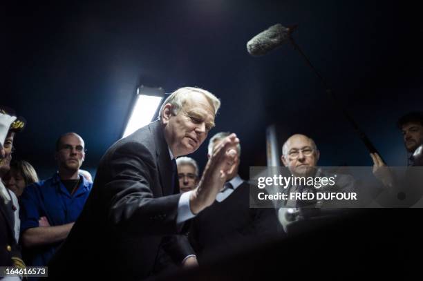 French Prime Minister Jean-Marc Ayrault gestures during a visit focused on employment on March 25, 2013 in Mitry-Mory, North East of Paris, at the...