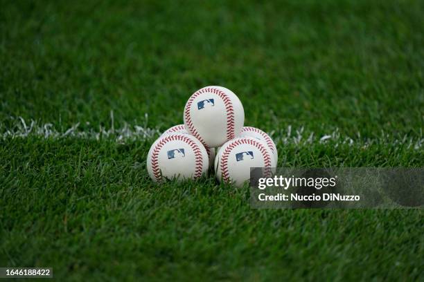 Detail shot of baseballs on the grass prior to a game between the Chicago White Sox and he Oakland Athletics at Guaranteed Rate Field on August 26,...