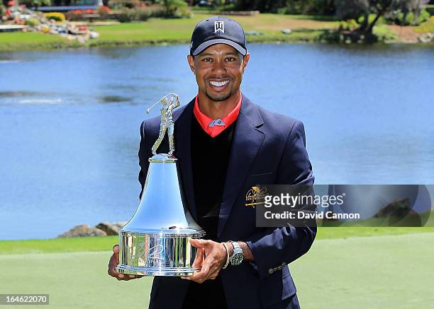 Tiger Woods of the United States proudly holds the trophy the win meant he re-gained the World's number one position after the final round of the...