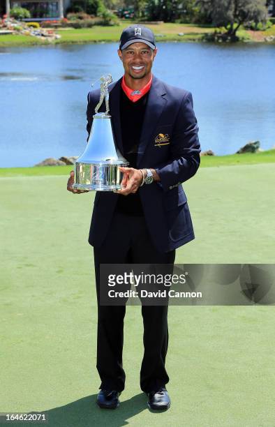 Tiger Woods of the United States proudly holds the trophy the win meant he re-gained the World's number one position after the final round of the...