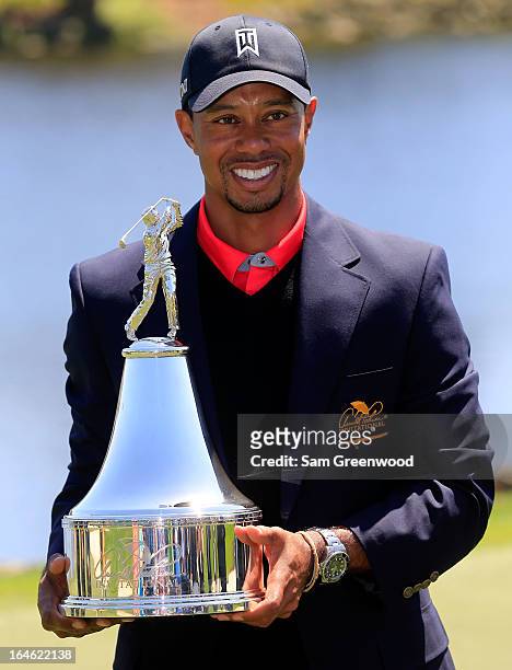 Tiger Woods holds the trophy after winning the Arnold Palmer Invitational presented by MasterCard at the Bay Hill Club and Lodge on March 24, 2013 in...