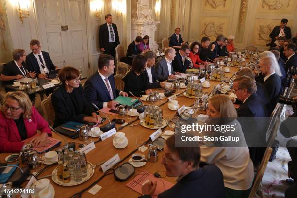 German Chancellor Olaf Scholz leads a meeting at the beginning of a two-day retreat of the German federal government cabinet at Schloss Meseberg on...