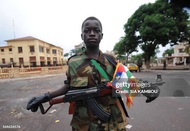 Young Seleka coalition rebel poses on March 25, 2013 near the presidential palace in Bangui. The UN Security Council will hold urgent talks on March...