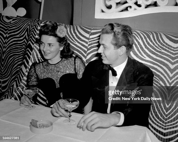 Society bay Robert Goelet, Jr., is pictured at El Morocco Night Club with Jane Munroe, of Boston, Mass.