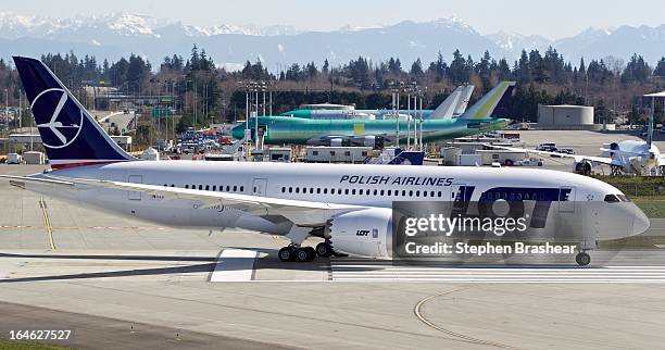 Polish Airlines Boeing 787 Dreamliner, with a redesigned lithium ion battery, taxis from the flight line to the runway before a test flight March 25,...