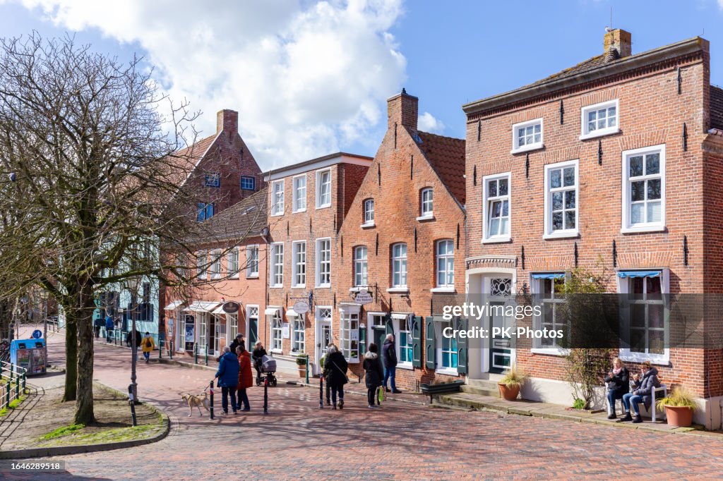 Tourists walking through the market in Greetsiel on the East Frisian North Sea coast, Germany