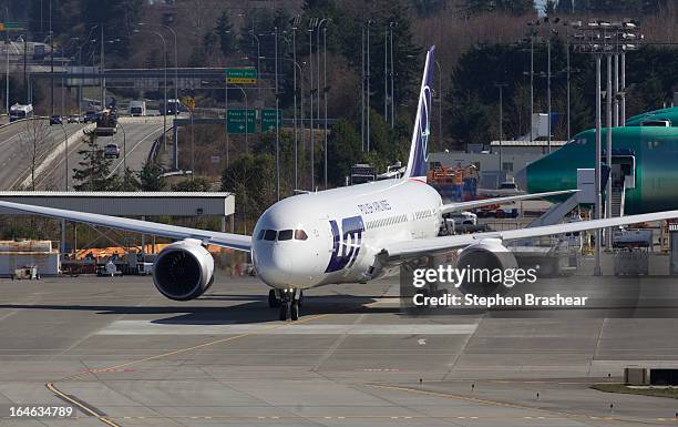 Polish Airlines Boeing 787 Dreamliner with a redesigned lithium ion battery taxis from the flight line to the runway before a test flight March 25,...