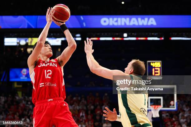 Yuta Watanabe of Japan shoots under pressure from Joe Ingles of Australia during the FIBA Basketball World Cup Group E game between Australia and...