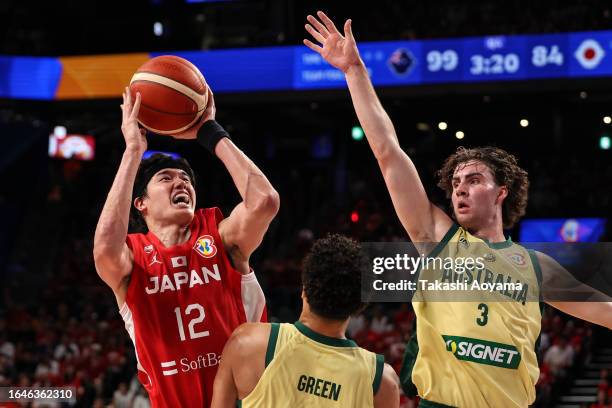 Yuta Watanabe of Japan shoots under pressure from Josh Green and Josh Giddey of Australia during the FIBA Basketball World Cup Group E game between...